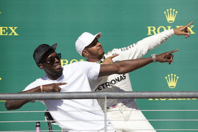 Hamilton does a `Lightening Bolt’ celebration on the podium: 2 sporting legends meet